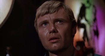 Movie still from “Midnight Cowboy” (1969), directed by John Schlesinger – A person looking up at the sky; Close Up shot, Low angle