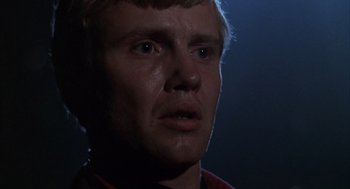 Movie still from “Midnight Cowboy” (1969), directed by John Schlesinger – A man's face in the dark; Close Up shot, Low angle