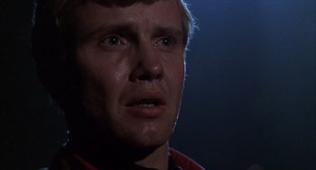 Movie still from “Midnight Cowboy” (1969), directed by John Schlesinger – A man's face in the dark; Close Up shot, Low angle