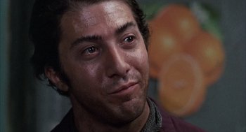 Movie still from “Midnight Cowboy” (1969), directed by John Schlesinger – A man's eyes and face; Close Up shot, Low angle