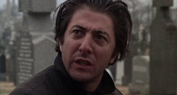 Movie still from “Midnight Cowboy” (1969), directed by John Schlesinger – A person wearing a black jacket; Close Up shot, Low angle