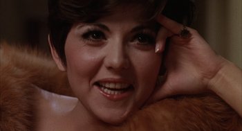 Movie still from “Midnight Cowboy” (1969), directed by John Schlesinger – A woman's face with her hand on her head; Close Up shot, Low angle