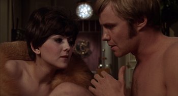 Movie still from “Midnight Cowboy” (1969), directed by John Schlesinger – A man and a woman looking at one another; Close Up shot, Over the shoulder angle