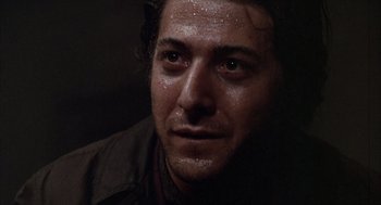 Movie still from “Midnight Cowboy” (1969), directed by John Schlesinger – A man's face covered in water drops; Close Up shot, Low angle