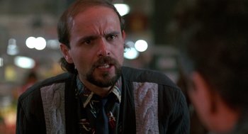 Movie still from “Midnight Run” (1988), directed by Martin Brest – A person wearing a tie; Close Up shot, Low angle