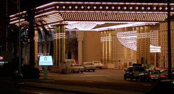 Movie still from “Midnight Run” (1988), directed by Martin Brest – Cars are parked on the side of the street; Extreme Wide shot, Low angle