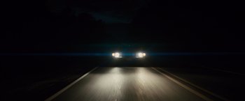 Movie still from “Midnight Special” (2016), directed by Jeff Nichols – A car driving down a dark road at night; Extreme Wide shot, Low angle