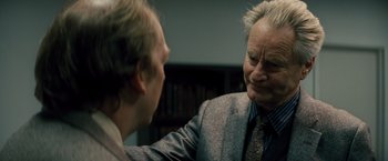 Movie still from “Midnight Special” (2016), directed by Jeff Nichols – An older man and a younger man in a room; Close Up shot, Over the shoulder angle