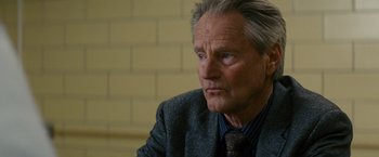 Movie still from “Midnight Special” (2016), directed by Jeff Nichols – An older man wearing a jacket and a tie; Close Up shot, Over the shoulder angle