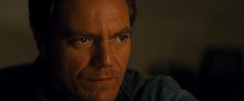 Movie still from “Midnight Special” (2016), directed by Jeff Nichols – A man's face in a dark room; Close Up shot, Low angle