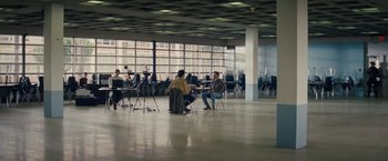 Movie still from “Midnight Special” (2016), directed by Jeff Nichols – A group of people sitting around a room; Extreme Wide shot, High angle