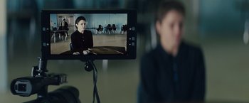Movie still from “Midnight Special” (2016), directed by Jeff Nichols – A man is sitting in front of a video camera; Close Up shot, Over the shoulder angle