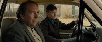 Movie still from “Midnight Special” (2016), directed by Jeff Nichols – Two men sitting in the back seat of a car; Close Up shot, Over the shoulder angle