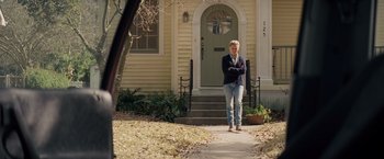 Movie still from “Midnight Special” (2016), directed by Jeff Nichols – A man standing in front of a house; Wide shot, Over the shoulder angle