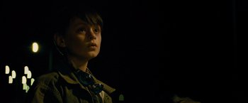 Movie still from “Midnight Special” (2016), directed by Jeff Nichols – A young boy wearing a brown jacket and a blue necklace; Close Up shot, Low angle