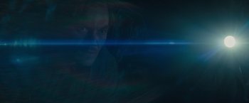 Movie still from “Midnight Special” (2016), directed by Jeff Nichols – A man with a blue light in a dark room; Extreme Close Up shot, Overhead angle