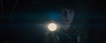 Movie still from “Midnight Special” (2016), directed by Jeff Nichols – A person holding a flashlight in a dark room; Close Up shot, Low angle