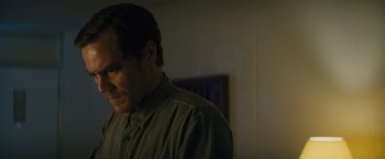 Movie still from “Midnight Special” (2016), directed by Jeff Nichols – A person wearing a green shirt; Close Up shot, Over the shoulder angle