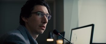 Movie still from “Midnight Special” (2016), directed by Jeff Nichols – A man with glasses is speaking into a microphone; Close Up shot, Over the shoulder angle