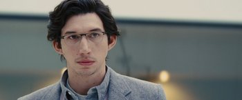 Movie still from “Midnight Special” (2016), directed by Jeff Nichols – A person wearing glasses and a jacket; Close Up shot, Over the shoulder angle