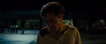Movie still from “Midnight Special” (2016), directed by Jeff Nichols – A man in a white shirt with blood all over his body; Close Up shot, Low angle