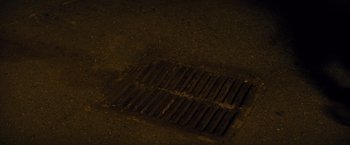 Movie still from “Midnight Special” (2016), directed by Jeff Nichols – A grate on the ground; Extreme Close Up shot, Overhead angle