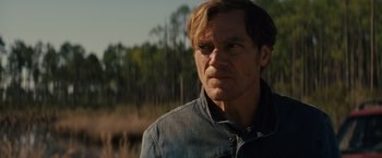 Movie still from “Midnight Special” (2016), directed by Jeff Nichols – A person wearing a jean jacket; Close Up shot, Over the shoulder angle
