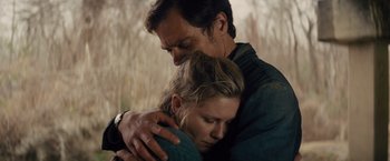 Movie still from “Midnight Special” (2016), directed by Jeff Nichols – A man and a woman embracing each other; Close Up shot, Low angle