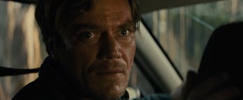 Movie still from “Midnight Special” (2016), directed by Jeff Nichols – A man's face in a car; Close Up shot, Over the shoulder angle