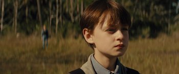 Movie still from “Midnight Special” (2016), directed by Jeff Nichols – A young boy is looking to his left; Close Up shot, High angle