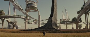 Movie still from “Midnight Special” (2016), directed by Jeff Nichols – A man standing in a field looking at a tall building; Extreme Wide shot, Low angle
