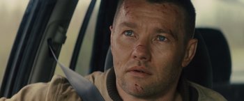 Movie still from “Midnight Special” (2016), directed by Jeff Nichols – A person in a car with blood on his face; Close Up shot, Over the shoulder angle