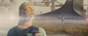 Movie still from “Midnight Special” (2016), directed by Jeff Nichols – A man standing in a field looking out at a bridge; Extreme Wide shot, Over the shoulder angle
