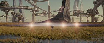 Movie still from “Midnight Special” (2016), directed by Jeff Nichols – A man standing in a field near a bridge; Extreme Wide shot, Low angle