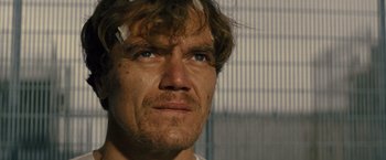 Movie still from “Midnight Special” (2016), directed by Jeff Nichols – A person wearing a white t - shirt; Close Up shot, Low angle