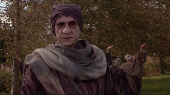 Movie still from “Mighty Aphrodite” (1995), directed by Woody Allen – A group of people dressed up in costumes; Medium shot, Low angle