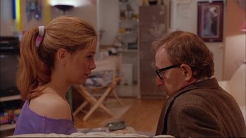 Movie still from “Mighty Aphrodite” (1995), directed by Woody Allen – A man and a woman sitting in a living room; Medium shot, Over the shoulder angle