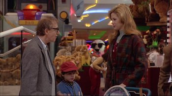 Movie still from “Mighty Aphrodite” (1995), directed by Woody Allen – A man and a woman talking to a child; Medium shot, Over the shoulder angle