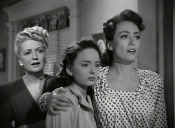 Movie still from “Mildred Pierce” (1945), directed by Michael Curtiz – A group of women standing next to each other in a room; Medium shot, High angle