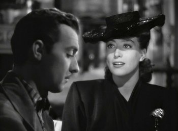 Movie still from “Mildred Pierce” (1945), directed by Michael Curtiz – A man and a woman are looking at one another; Close Up shot, Over the shoulder angle