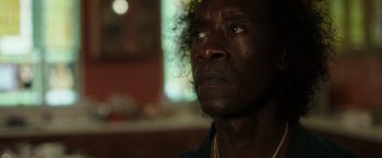 Movie still from “Miles Ahead” (2015), directed by Don Cheadle – A person looking up at the sky; Close Up shot, Low angle