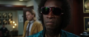 Movie still from “Miles Ahead” (2015), directed by Don Cheadle – A person wearing sunglasses; Close Up shot, Low angle