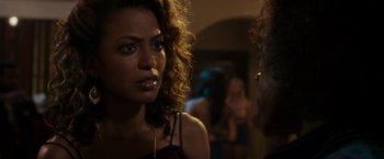 Movie still from “Miles Ahead” (2015), directed by Don Cheadle – A person with curly hair; Close Up shot, Over the shoulder angle