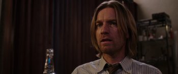 Movie still from “Miles Ahead” (2015), directed by Don Cheadle – A person with long hair; Close Up shot, Over the shoulder angle