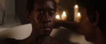 Movie still from “Miles Ahead” (2015), directed by Don Cheadle – A person with his hand on his head; Close Up shot, Over the shoulder angle