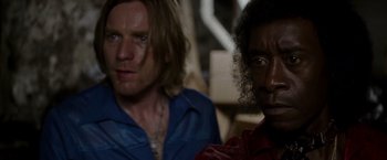 Movie still from “Miles Ahead” (2015), directed by Don Cheadle – Two people sitting next to each other in a room; Close Up shot, Over the shoulder angle