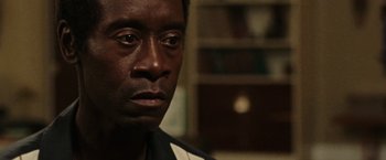 Movie still from “Miles Ahead” (2015), directed by Don Cheadle – A person looking at the camera; Close Up shot, Over the shoulder angle