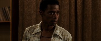 Movie still from “Miles Ahead” (2015), directed by Don Cheadle – A person wearing a shirt; Close Up shot, High angle