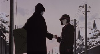 Movie still from “Millennium Actress” (2001), directed by Kô Matsuo – A man and a woman shaking hands in front of power lines; Medium shot, Low angle
