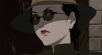 Movie still from “Millennium Actress” (2001), directed by Kô Matsuo – An animated woman wearing a hat and glasses; Close Up shot, Low angle